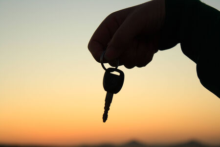 Holding an key silhouetteの写真素材