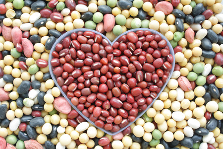 Beans are combined into the shape of heartの写真素材