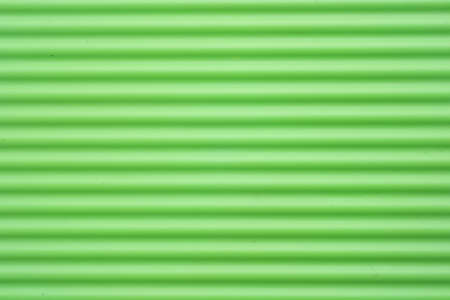 Green plastic stripesの写真素材