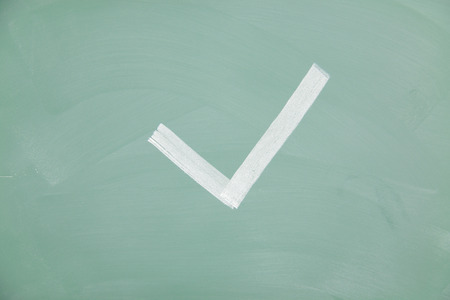 Checkmark drawn on a blackboard