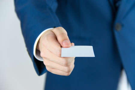 Man hand holding a business cardの写真素材