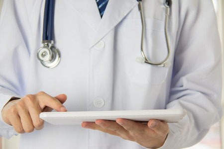 Doctor using Tablet PCの写真素材