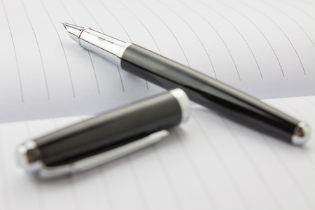Fountain pen in a notebookの写真素材