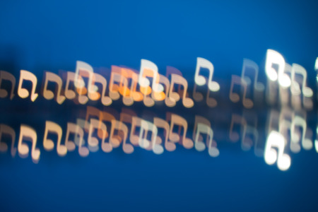 Fuzzy music notation shaped lights, defocused backgroundの写真素材