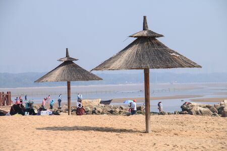 Grass umbrellas at the beach