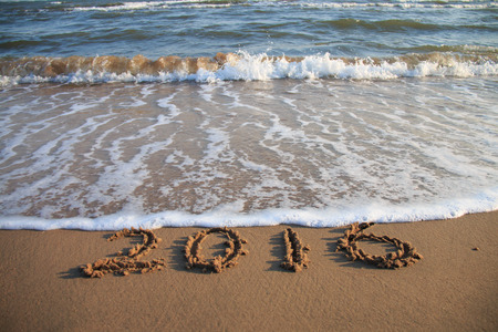 2016 New Year written on the beachの写真素材