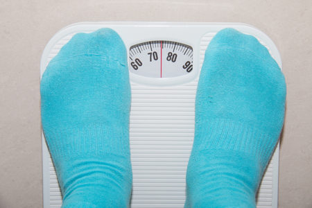 Closeup of a Asians weighedの写真素材