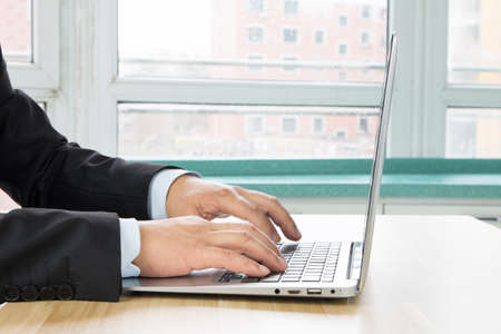 Businessman using laptop at workの写真素材