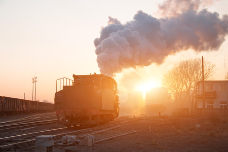 Steam locomotive at sunset