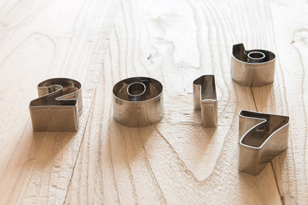 New Year 2017 on a wood backgroundの写真素材