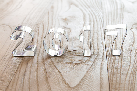 New Year 2017 on a wood backgroundの写真素材