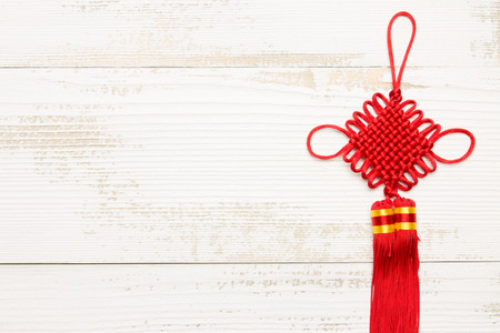 Chinese New Year knot in white woodの写真素材