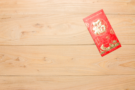 Chinese New Year red packets in the woodの写真素材