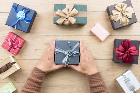 Man holding a Christmas presentの写真素材