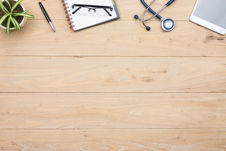 Stethoscope & some accesories in doctors deskの写真素材