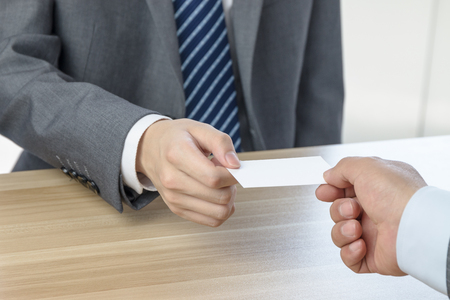 Businessman exchanging business cardsの写真素材