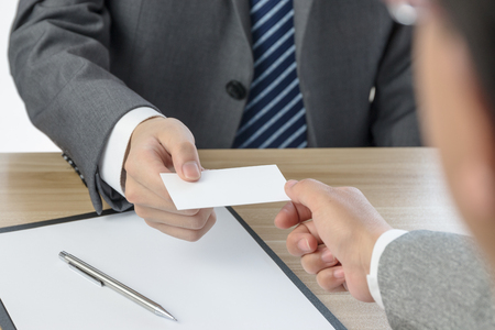 Businessman exchanging business cardsの写真素材