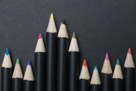 Black color pencil on black backgroundの写真素材