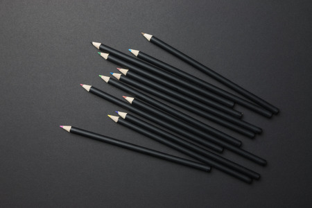 Black color pencil on black backgroundの写真素材