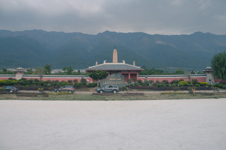 The stone tablet is engraved with "National Five-A Grade Scenic Spot and Chongsheng Temple Three Pagodas Cultural Tourism Area."のeditorial素材