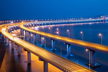Night view of the sea bridge in Dalian, Chinaの写真素材