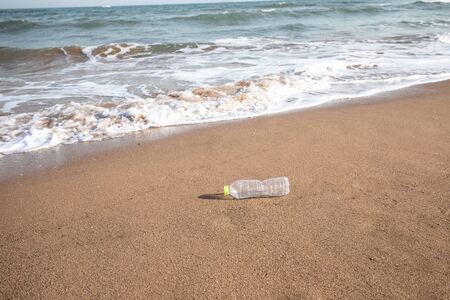 Abandoned plastic bottle on the beach
