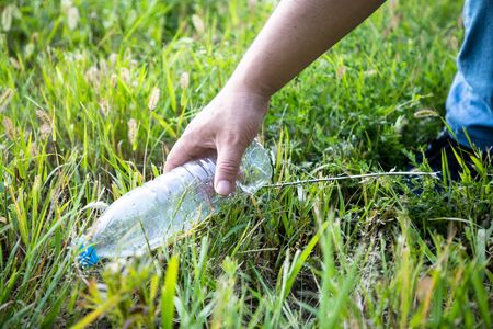 Pick up the plastic bottleの写真素材