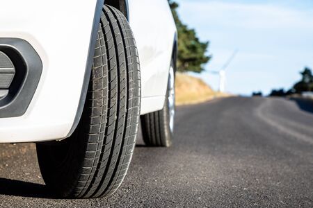 Closeup white car on the roadの写真素材