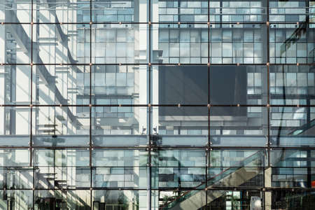 Closeup modern blue glass buildingの写真素材