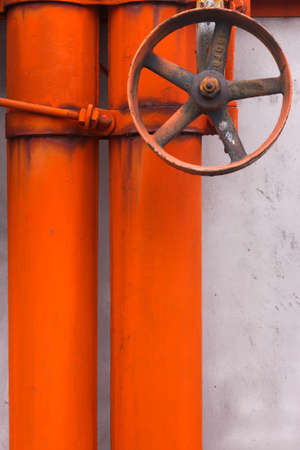 Orange industrial pipes and valveの写真素材