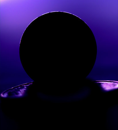 Silhouette of a sphere of coins on a dark background. Abstract background.