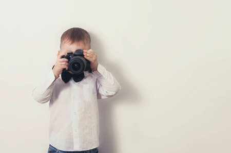 a little boy with a cameraの写真素材