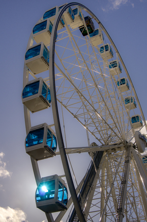Helsinki, Finland - September 3, 2014. Ferris wheel with blue cabins in the port of Helsinki. Helsinki welcomes guests various entertainmentsのeditorial素材