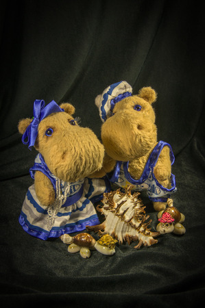 Two dolls of hippos, dressed in naval clothing.の写真素材
