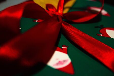 Green pattern gift wrapped with red bowl