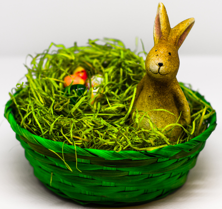 Easter bunny in green nest with glass eggsの写真素材