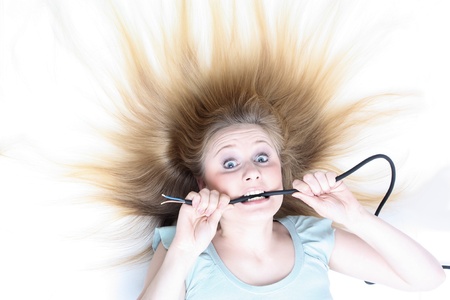 Girl under electricityの写真素材