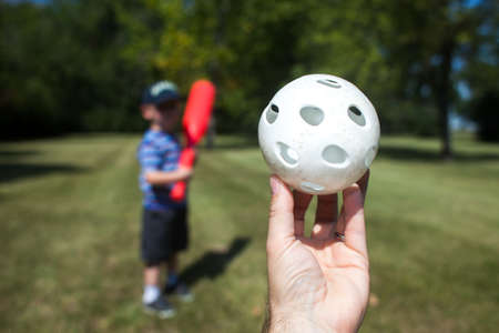 Youth waits for wiffle ball pitch