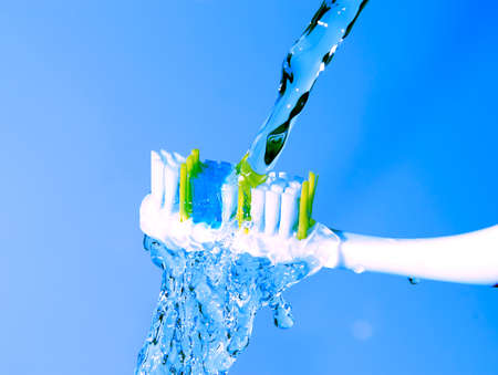 toothbrush under the running waterの写真素材