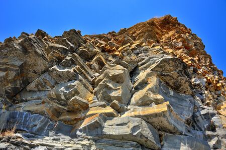 beautiful yellow cliff of sharp sandstone with aiguille