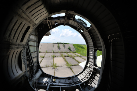 the internal structure of the old fighter aircraft, rustypart of plave from inside, old nozzle of...