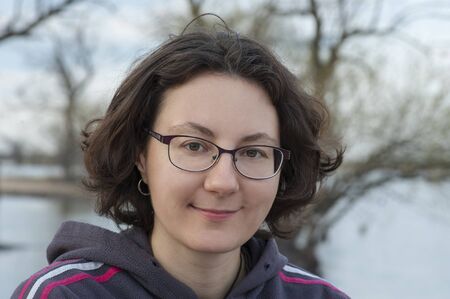 portrait of smiling woman in glasses,