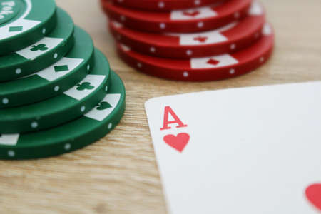 Poker game with ace of hearts and chips