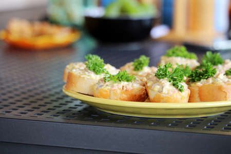 Savory with spread and vegetables on the tableの写真素材