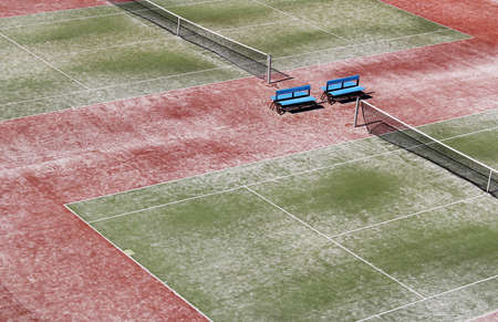 Empty hard green tennis court with netの写真素材