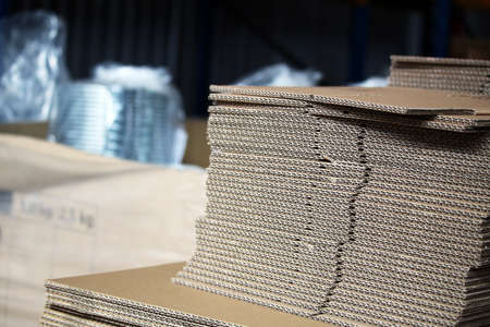 Unfolded cardboards for boxes in the warehouseの写真素材