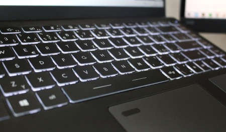 Cool black laptop keyboard with backlit buttons