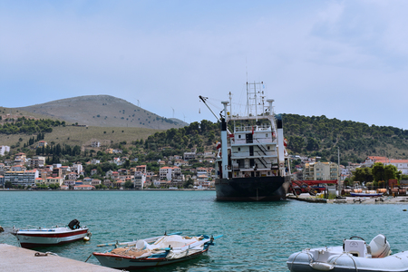 a transport boat in a port in a small village in Greeceのeditorial素材