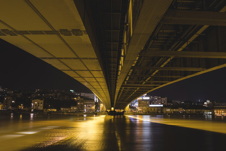 Under Brankov bridge with light near riverの写真素材