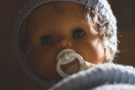 Doll with blue eyes and sootherの写真素材